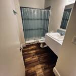 South Villa guest bathroom at Mars Bay Bonefish Lodge with a tiled walk-in shower.